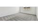 Bedroom with gray carpet and a window overlooking the backyard at 1686 Fallon Pass, Zephyrhills, FL 33541