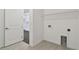 Laundry room with tile flooring and access to kitchen at 1686 Fallon Pass, Zephyrhills, FL 33541