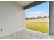 Covered patio overlooking a fenced backyard at 1686 Fallon Pass, Zephyrhills, FL 33541