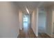 Bright hallway with wood-look flooring leading to other rooms at 11116 40Th E Ave, Palmetto, FL 34221