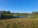 Expansive backyard with a pond view, perfect for outdoor enjoyment at 11207 40Th E Ave, Palmetto, FL 34221