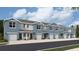 New construction townhomes feature a modern exterior, private garages, and neutral color palette at 4211 Red Banks Ln, Bradenton, FL 34208