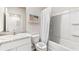 Clean bathroom featuring white cabinets, a bathtub-shower combo, and a neutral color scheme at 4219 Red Banks Ln, Bradenton, FL 34208