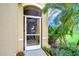 Screen door with decorative wrought iron and heron design at 2403 Richmond Greens Ct, Sun City Center, FL 33573