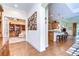 Hardwood floors, view into library and kitchen at 2403 Richmond Greens Ct, Sun City Center, FL 33573