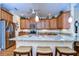 Island kitchen with granite counters, stainless steel appliances at 2403 Richmond Greens Ct, Sun City Center, FL 33573