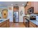 Kitchen with stainless steel appliances and granite countertops at 2403 Richmond Greens Ct, Sun City Center, FL 33573