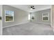 Spacious bedroom with neutral decor and gray carpet at 5607 Limelight Dr, Apollo Beach, FL 33572