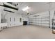 Two-car garage with epoxy flooring and overhead storage at 5607 Limelight Dr, Apollo Beach, FL 33572