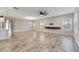 Spacious living room with tile floors and sliding glass doors to backyard at 5607 Limelight Dr, Apollo Beach, FL 33572