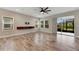 Spacious living room with tile floors and sliding glass doors to backyard at 5607 Limelight Dr, Apollo Beach, FL 33572