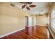 Large bedroom with hardwood floors, crown molding, and multiple access doors at 136 175Th E Ave, Redington Shores, FL 33708