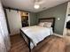 Cozy bedroom with a queen bed and barn door leading to laundry at 750 53Rd N Ave, St Petersburg, FL 33703