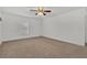 Spacious bedroom with ceiling fan and neutral walls at 10142 Kingsbridge Ave, Tampa, FL 33626