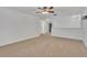 Upstairs bedroom with ceiling fan and neutral carpeting at 10142 Kingsbridge Ave, Tampa, FL 33626