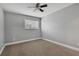 Bedroom featuring ceiling fan, window blinds, and carpet at 10142 Kingsbridge Ave, Tampa, FL 33626