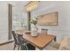 Modern farmhouse dining room with hardwood floors and chandelier at 10142 Kingsbridge Ave, Tampa, FL 33626