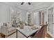 Home office with French doors opening to a dining area and built-in shelves at 10142 Kingsbridge Ave, Tampa, FL 33626