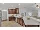 Modern kitchen with a large island, stainless steel appliances, and white countertops at 10142 Kingsbridge Ave, Tampa, FL 33626