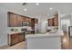 Modern kitchen with stainless steel appliances and dark wood cabinets at 10142 Kingsbridge Ave, Tampa, FL 33626