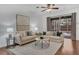 Relaxing living room with hardwood floors and pool view at 10142 Kingsbridge Ave, Tampa, FL 33626