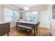 Dining room with built-in corner hutch and marble top table at 2367 Woodlawn W Cir, St Petersburg, FL 33704