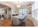 Bright dining area with marble table and hardwood floors at 2367 Woodlawn W Cir, St Petersburg, FL 33704