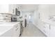 Modern kitchen with white cabinets and stainless steel appliances at 2367 Woodlawn W Cir, St Petersburg, FL 33704