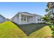 Single-story home with covered patio and grassy backyard at 11814 Richmond Trl, Parrish, FL 34219