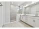 Modern bathroom with double vanity and walk-in shower at 11814 Richmond Trl, Parrish, FL 34219