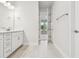 Clean bathroom with white cabinets and a view of another room at 11814 Richmond Trl, Parrish, FL 34219