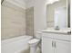 Neat bathroom with a shower/tub combo and white vanity at 11814 Richmond Trl, Parrish, FL 34219