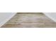 Light brown wood-look vinyl plank flooring at 11814 Richmond Trl, Parrish, FL 34219