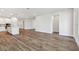 Open concept living room with hardwood floors and kitchen view at 11814 Richmond Trl, Parrish, FL 34219