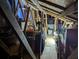Spacious attic with wooden beams and abundant storage at 16850 Whisper Elm St, Wimauma, FL 33598