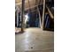 Unfinished attic space with plywood flooring and storage at 16850 Whisper Elm St, Wimauma, FL 33598