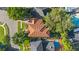 Aerial view of house with tile roof and pool at 207 Chippewa Ave, Tampa, FL 33606