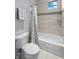 Clean bathroom with shower/tub combo and patterned shower curtain at 207 Chippewa Ave, Tampa, FL 33606