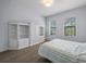 Charming bedroom with white built-ins and striped bedding at 207 Chippewa Ave, Tampa, FL 33606