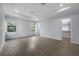 Bright bedroom featuring hardwood floors and walk-in closet at 207 Chippewa Ave, Tampa, FL 33606