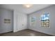 Bright bedroom with double doors and two large windows at 207 Chippewa Ave, Tampa, FL 33606