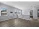 Upper level hallway with wood flooring and multiple windows at 207 Chippewa Ave, Tampa, FL 33606