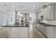 Modern kitchen with gray cabinets and large island at 207 Chippewa Ave, Tampa, FL 33606