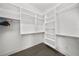 Well-organized walk-in closet with shelves and hanging rods at 207 Chippewa Ave, Tampa, FL 33606