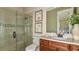 Bathroom with walk-in shower, granite vanity, and neutral decor at 4504 Isonzo Way, Wesley Chapel, FL 33543