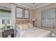 Guest bedroom with neutral decor and two framed prints at 4504 Isonzo Way, Wesley Chapel, FL 33543