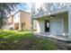 Backyard with grassy area and patio at 4978 White Sanderling Ct, Tampa, FL 33619