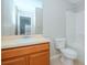 Clean bathroom with wood vanity and shower/tub combo at 4978 White Sanderling Ct, Tampa, FL 33619