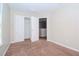 Well-lit bedroom with double doors and closet at 4978 White Sanderling Ct, Tampa, FL 33619