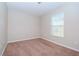 Simple bedroom with carpeted floor and window at 4978 White Sanderling Ct, Tampa, FL 33619